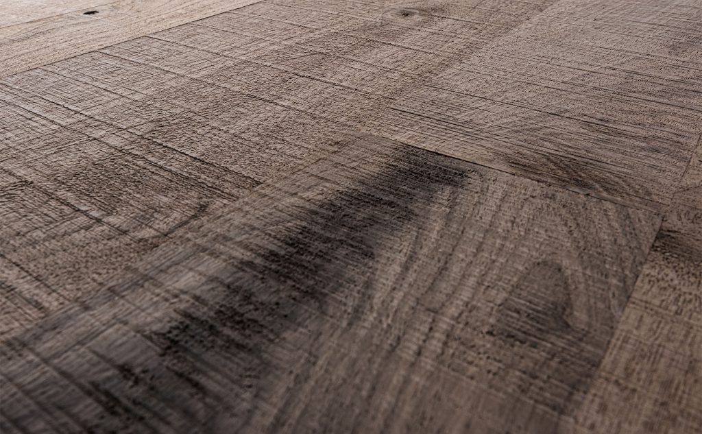 Walnut hardwood flooring with band sawn texture close up.