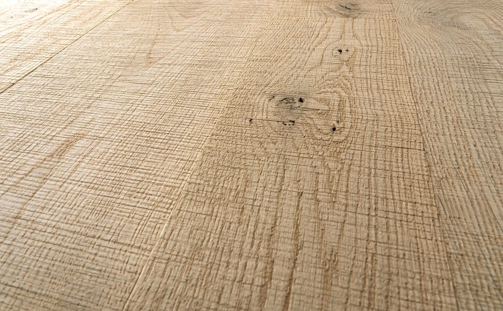White oak hardwood flooring with band sawn texture close up.