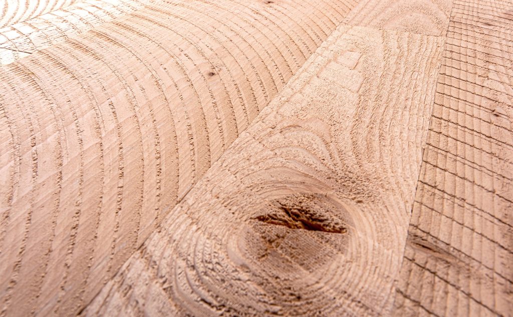 Douglas fir hardwood flooring with circle sawn texture close up.