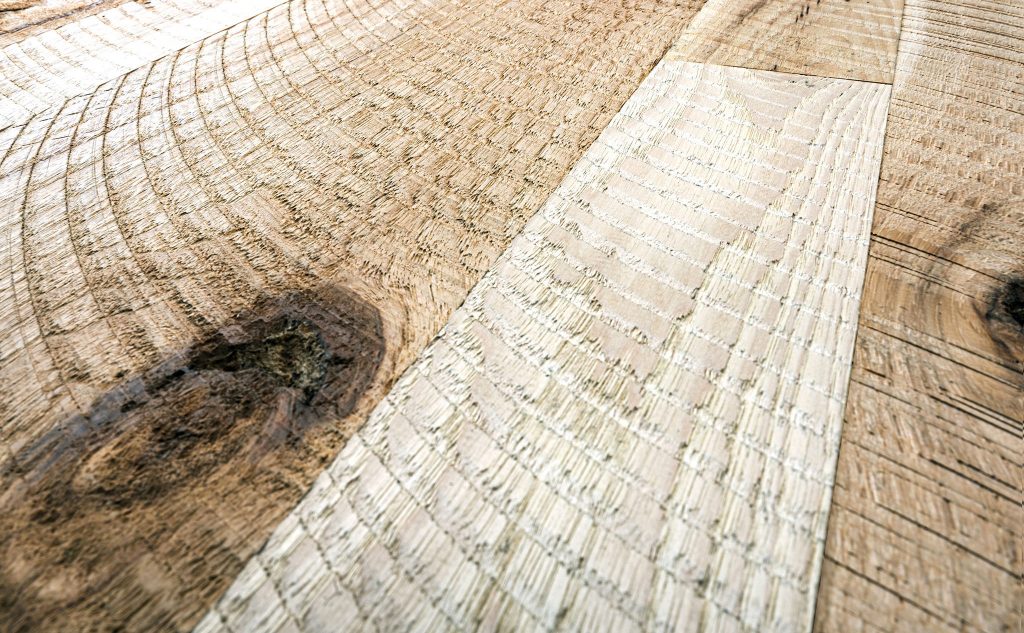 Hickory hardwood flooring with circle sawn texture close up.