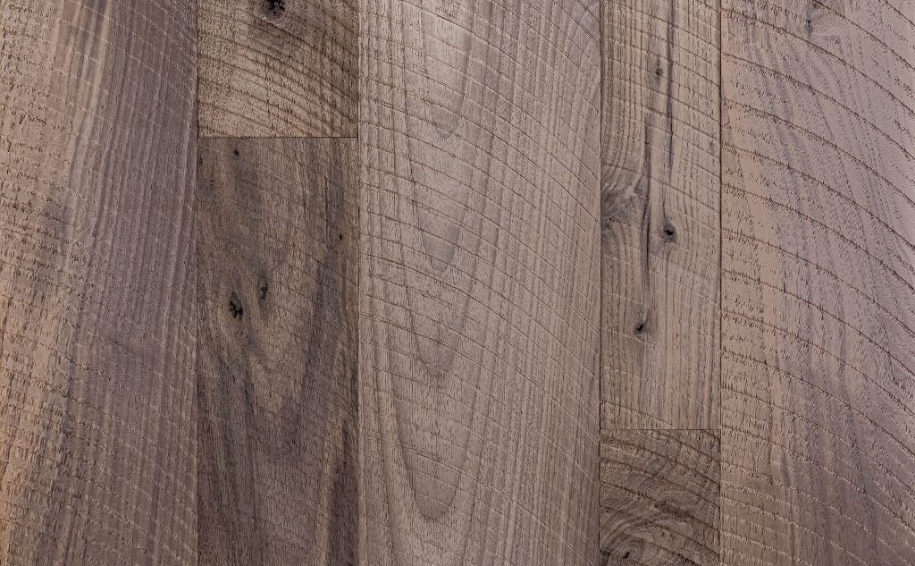Walnut hardwood flooring with circle sawn texture.
