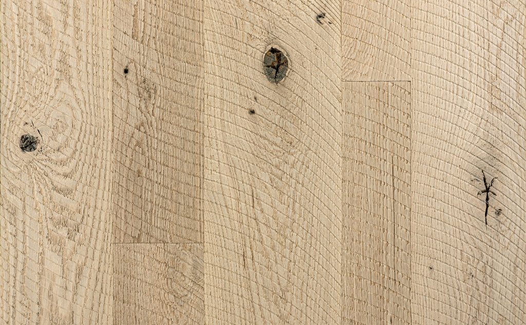White oak hardwood flooring with circle sawn texture.