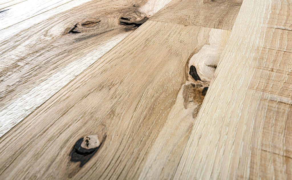 Hickory hardwood flooring with double decker texture close up.