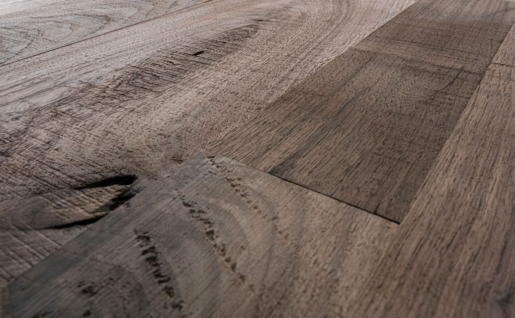 Walnut hardwood flooring with double decker texture close up.