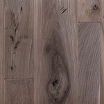 Walnut hardwood flooring with distressed texture.