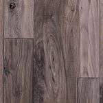 Walnut hardwood flooring with hand scraped and wire brushed texture.