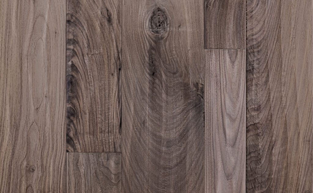 Walnut hardwood flooring with hand scraped texture.