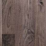 Walnut hardwood flooring with skip band and wire brush texture.