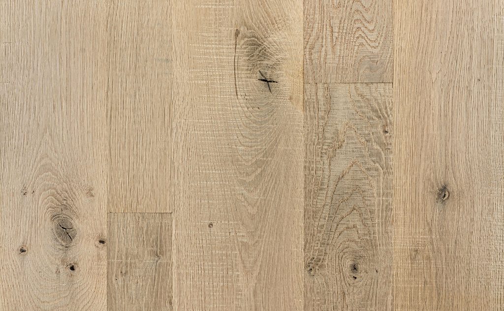 White oak hardwood flooring with wire brushed skip band texture.