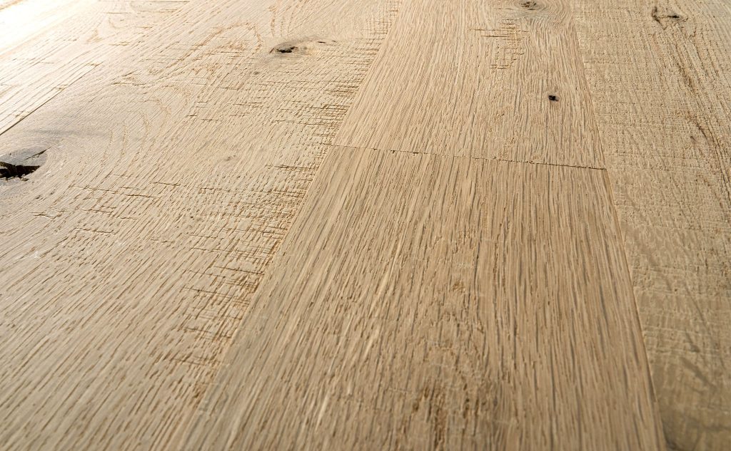 White oak hardwood flooring with skip band texture close up.