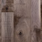 Walnut hardwood flooring with skip planed texture.