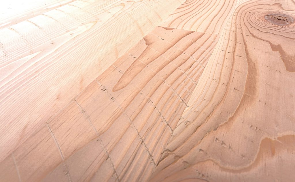 Douglas fir hardwood flooring with skip sawn texture close up.