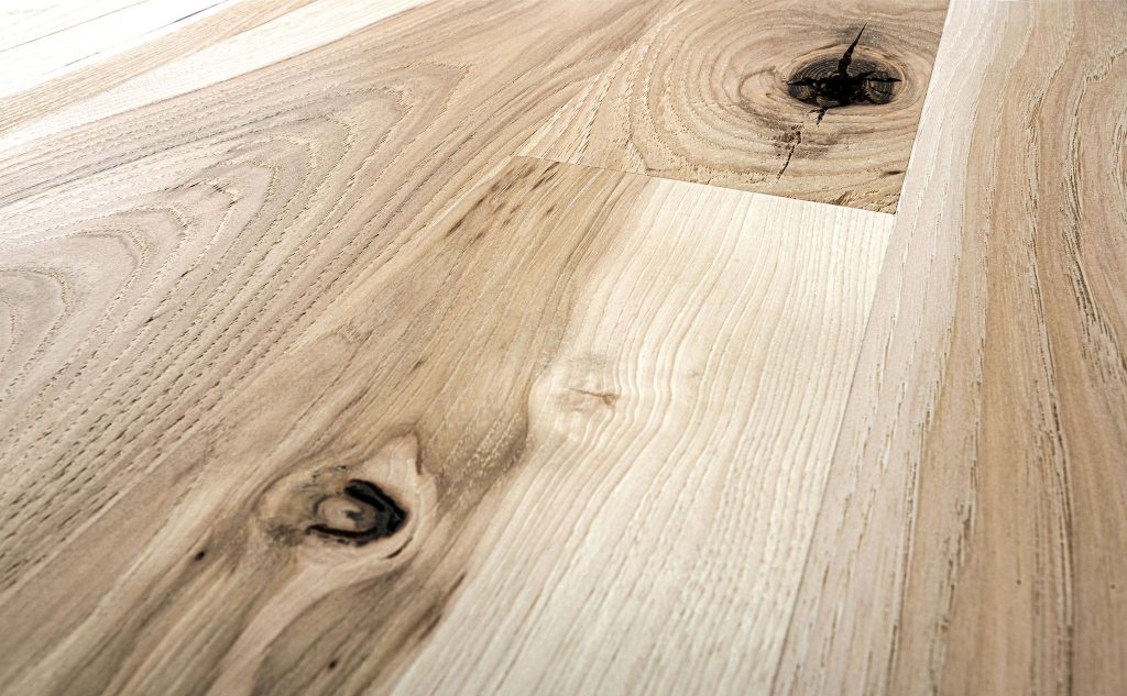 Smooth hickory hardwood flooring close up.