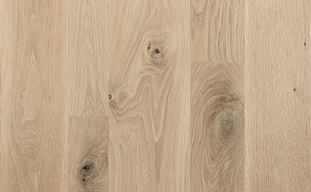 Smooth white oak hardwood flooring with light knots.
