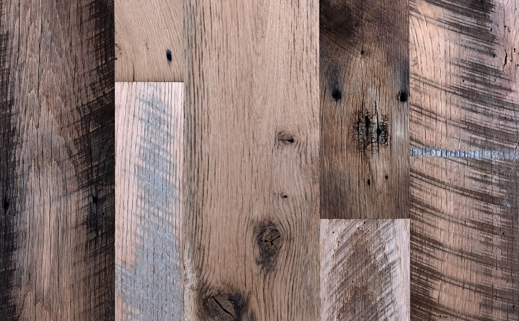 Antique oak hardwood flooring with weathered texture.
